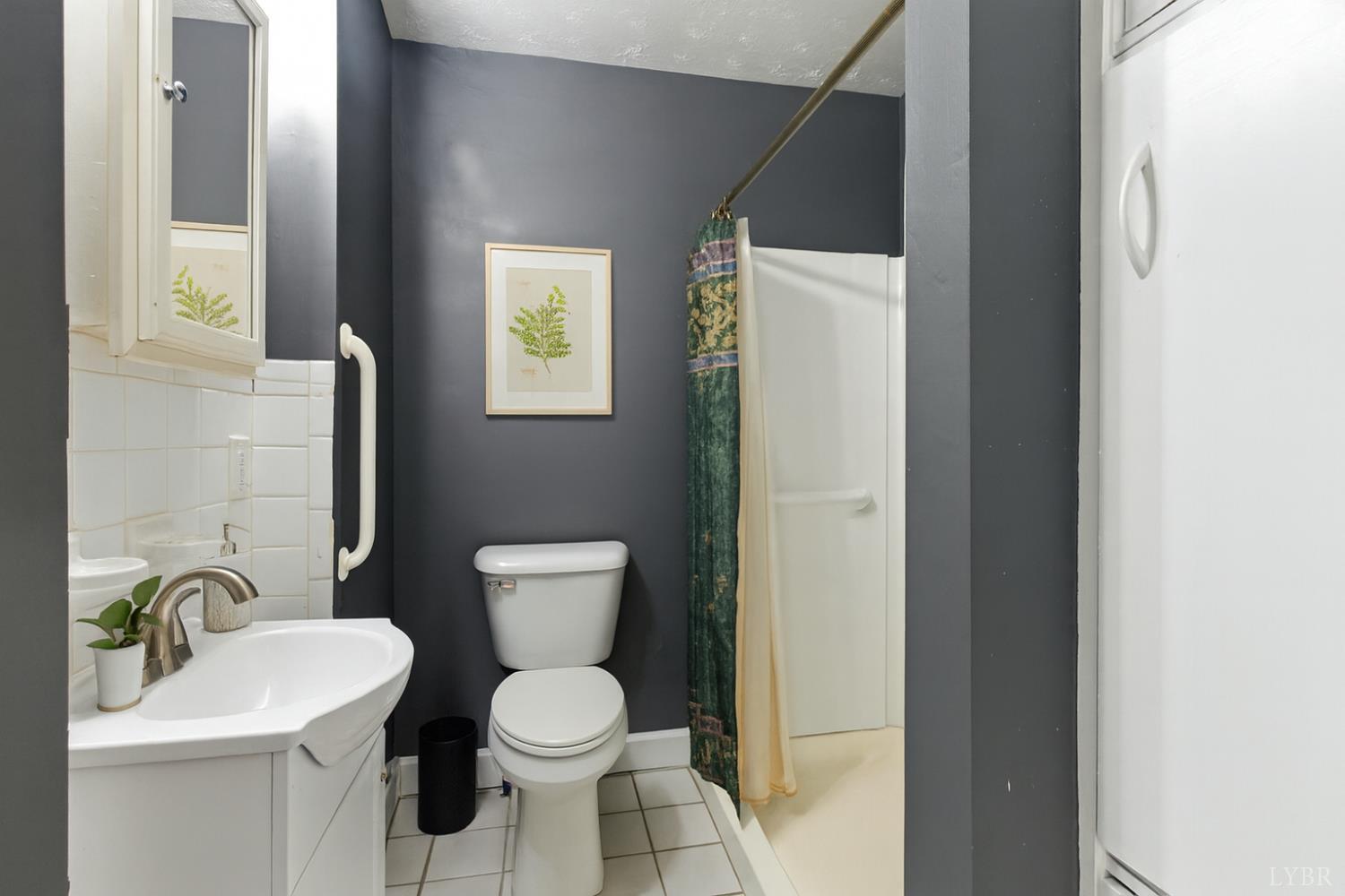 157 Old Country Road Monroe, VA 24574 - Photo 5 of 41 a bathroom with a toilet a sink and mirror