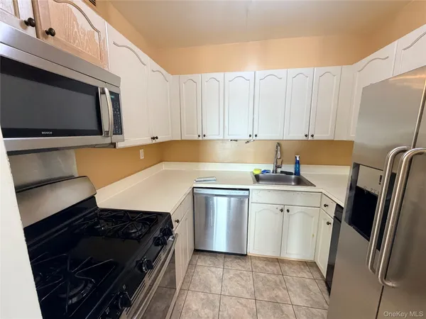 a kitchen with a stove microwave and refrigerator