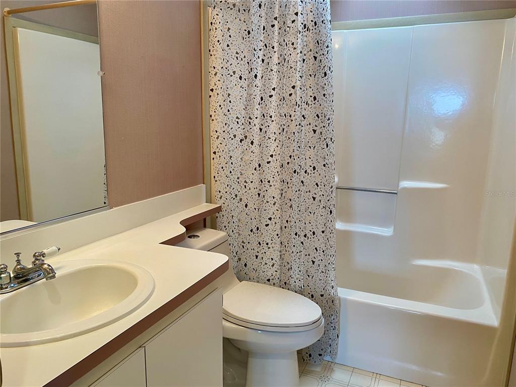 14517 Rialto Avenue Brooksville, FL 34613 - Photo 18 of 35 a bathroom with a sink toilet and shower