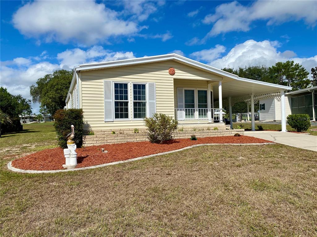 14517 Rialto Avenue Brooksville, FL 34613 - Photo 2 of 35 a front view of a house with a yard