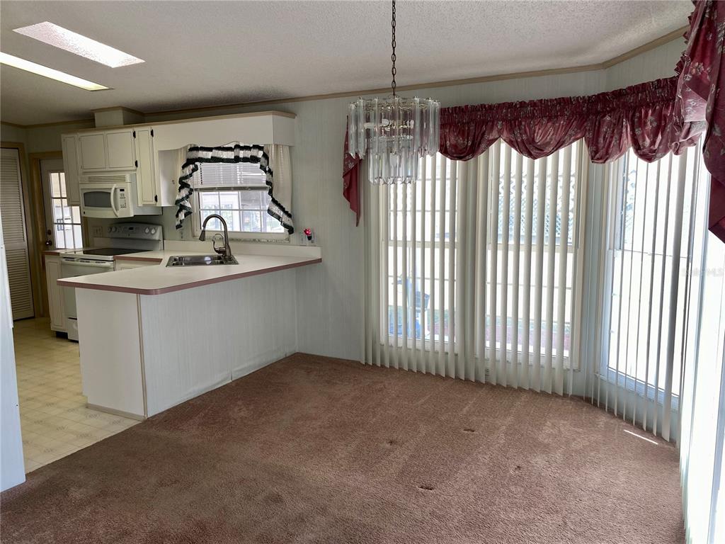14517 Rialto Avenue Brooksville, FL 34613 - Photo 24 of 35 a view of a kitchen with a sink
