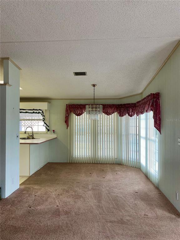 14517 Rialto Avenue Brooksville, FL 34613 - Photo 25 of 35 a view of an empty room with a window