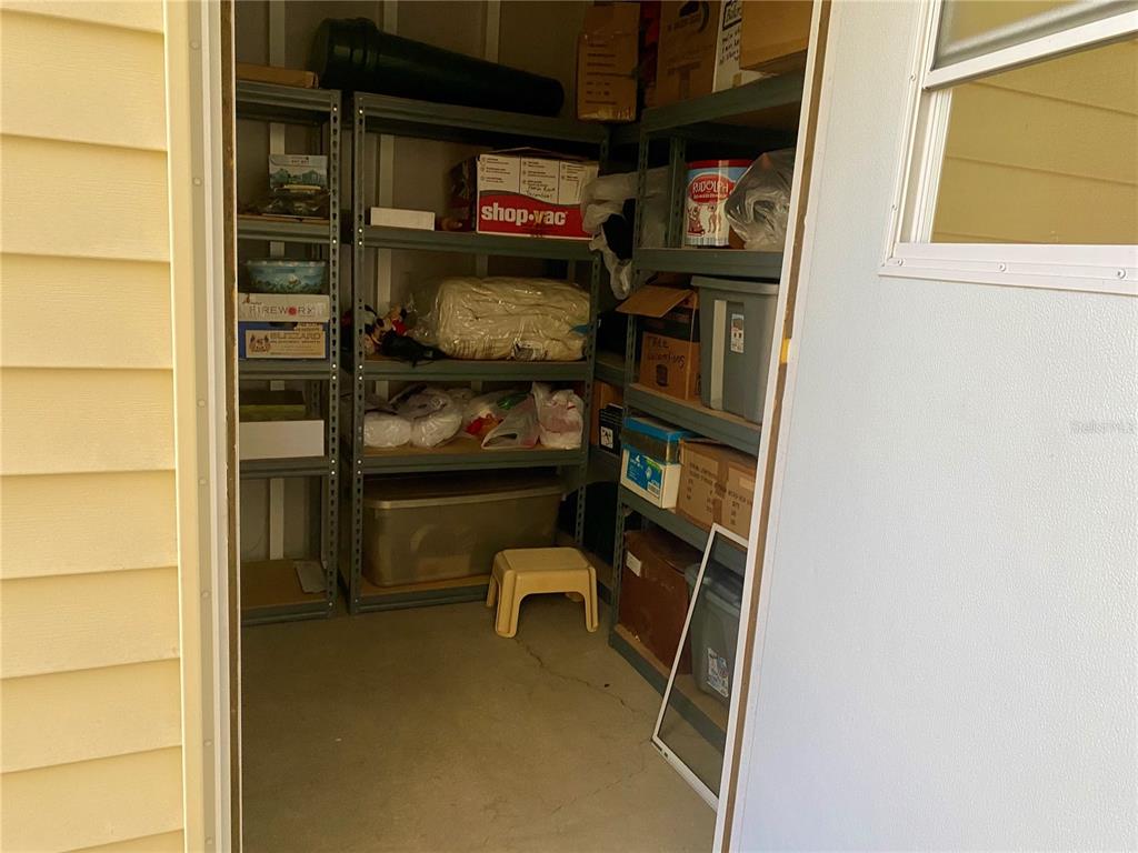 14517 Rialto Avenue Brooksville, FL 34613 - Photo 29 of 35 a room with storage and utility