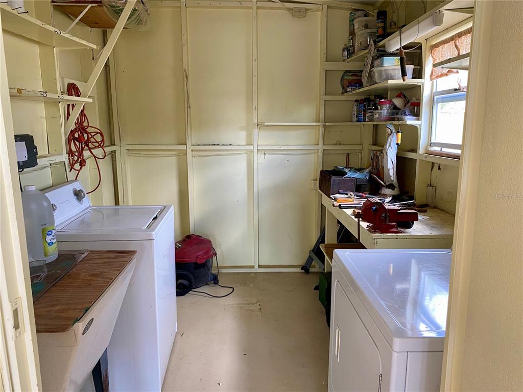 14517 Rialto Avenue Brooksville, FL 34613 - Photo 33 of 35 a room with storage and utility