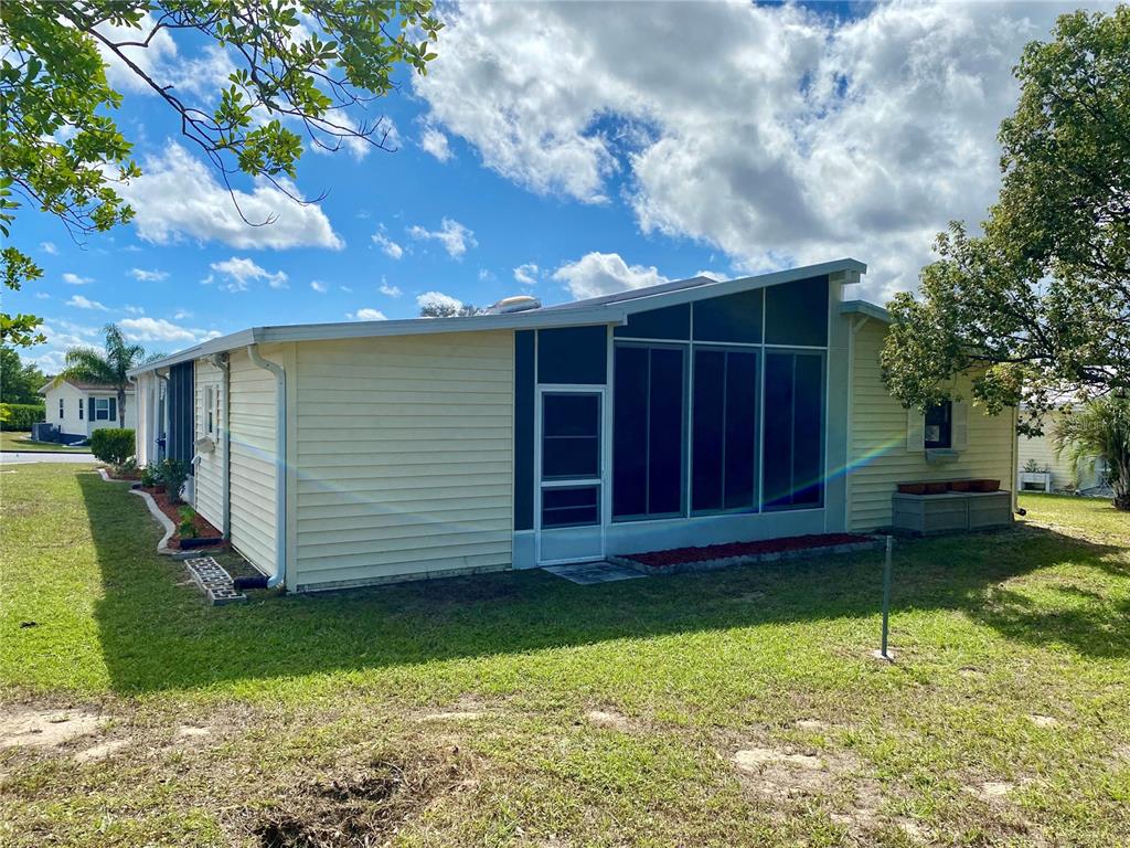 14517 Rialto Avenue Brooksville, FL 34613 - Photo 4 of 35 a view of a house with a yard