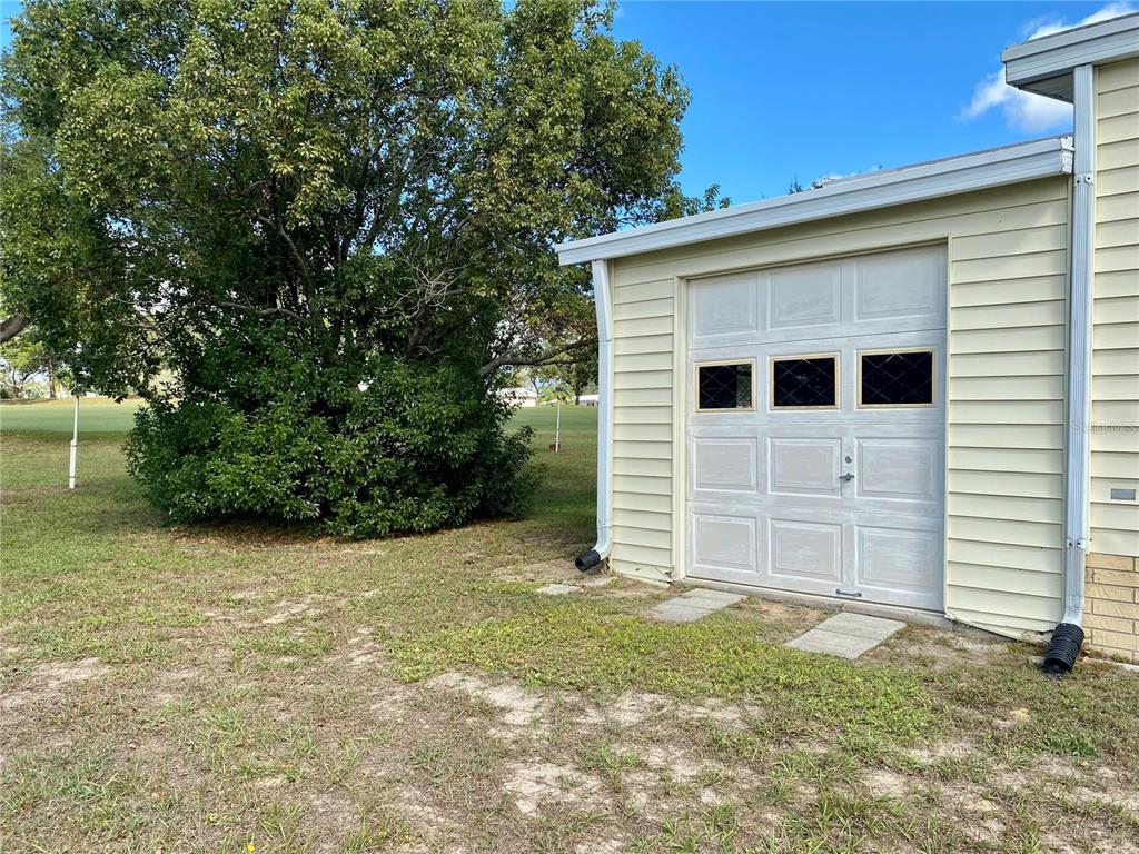 14517 Rialto Avenue Brooksville, FL 34613 - Photo 5 of 35 a view of a house with a yard