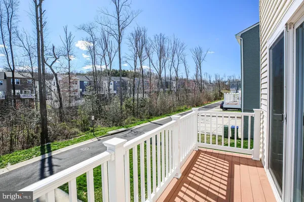 a large kitchen with cabinets wooden floor and a sink