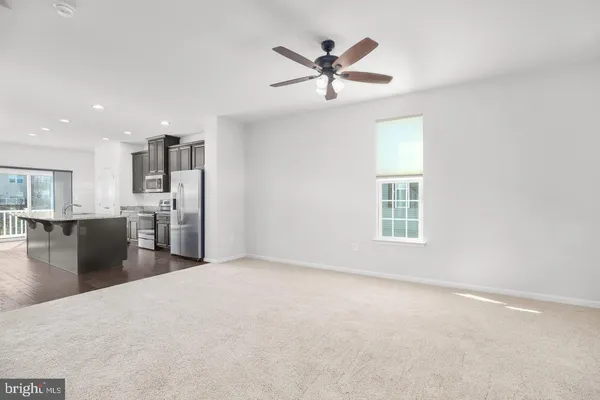 a view of a kitchen with a sink and microwave