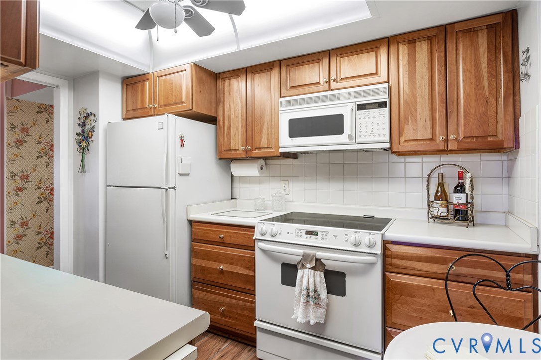 2956 Hathaway Road, Unit U301 Richmond, VA 23225 - Photo 14 of 36 a kitchen with stainless steel appliances granite countertop a refrigerator sink and cabinets