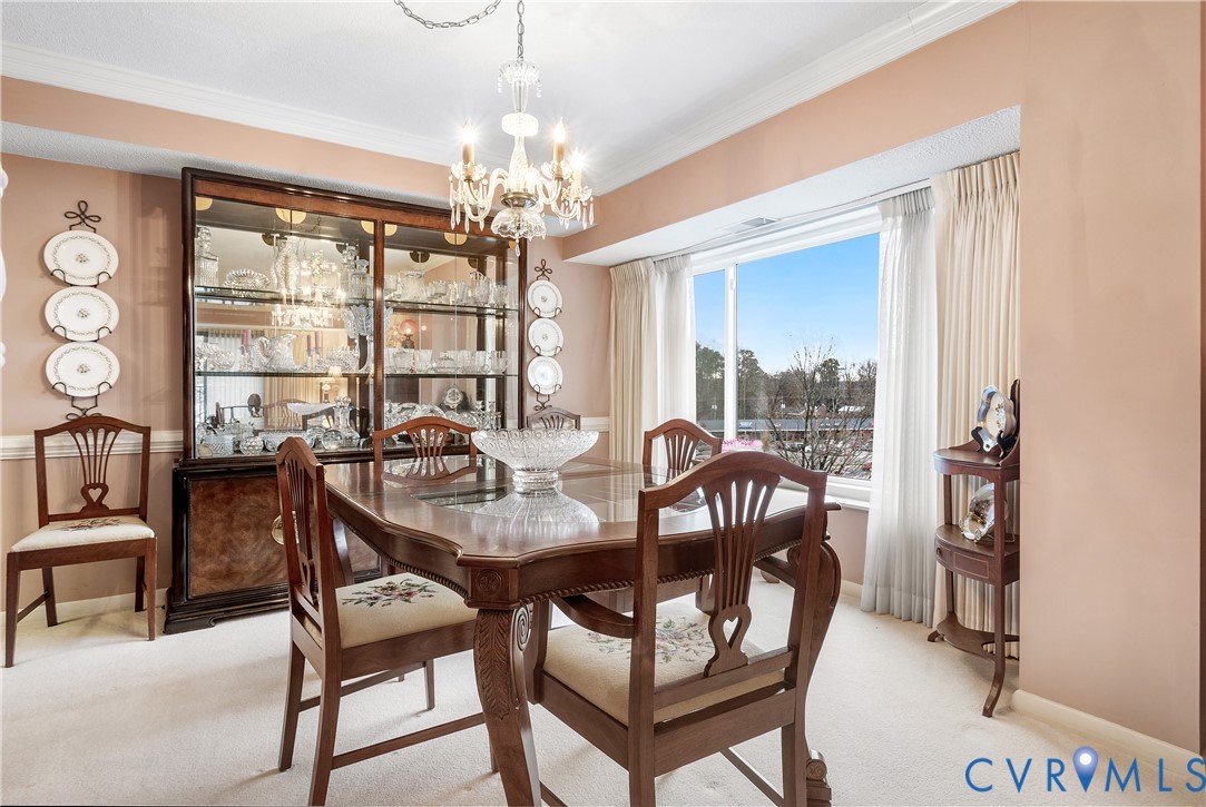 2956 Hathaway Road, Unit U301 Richmond, VA 23225 - Photo 17 of 36 a view of a dining room with furniture a chandelier and window