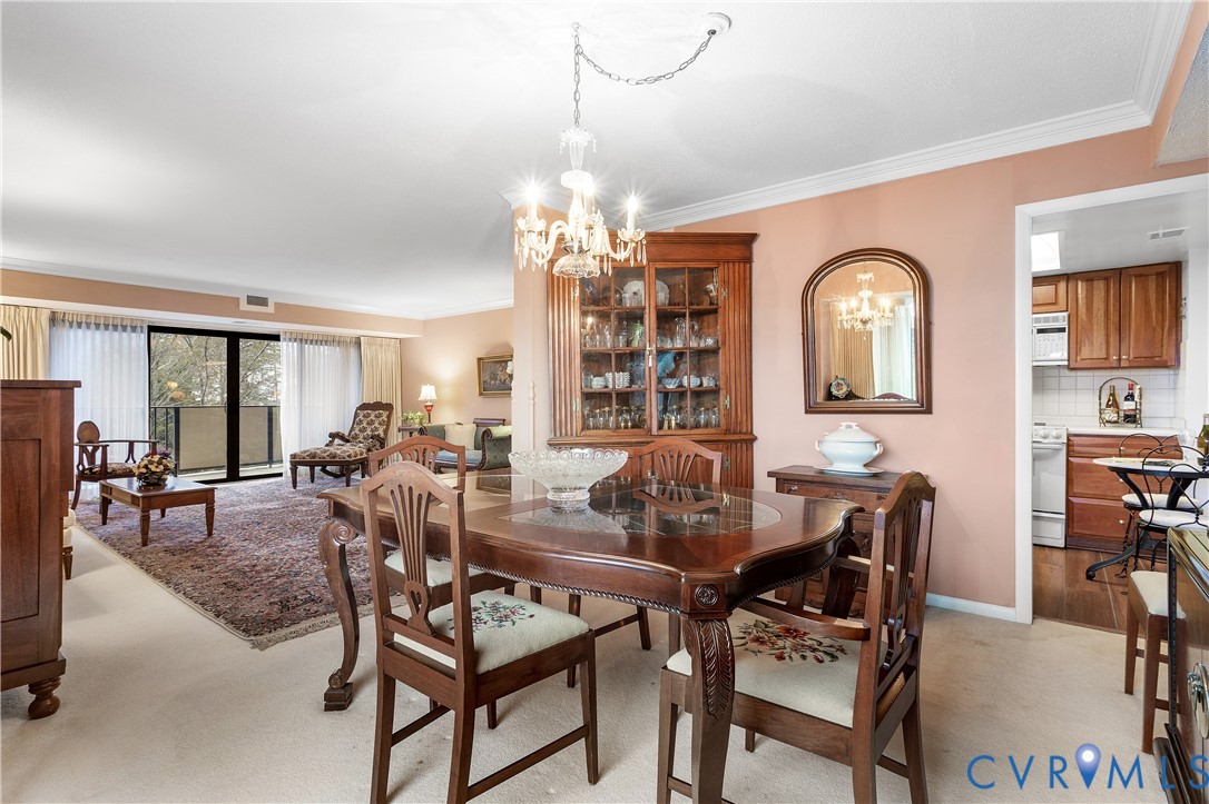 2956 Hathaway Road, Unit U301 Richmond, VA 23225 - Photo 18 of 36 a view of a dining room with furniture and chandelier