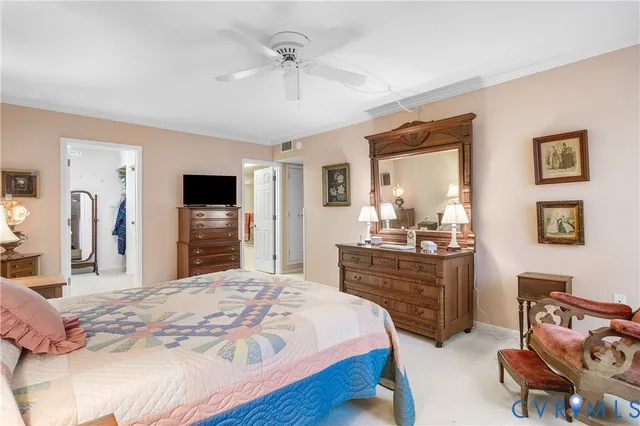 a bedroom with a bed and a television