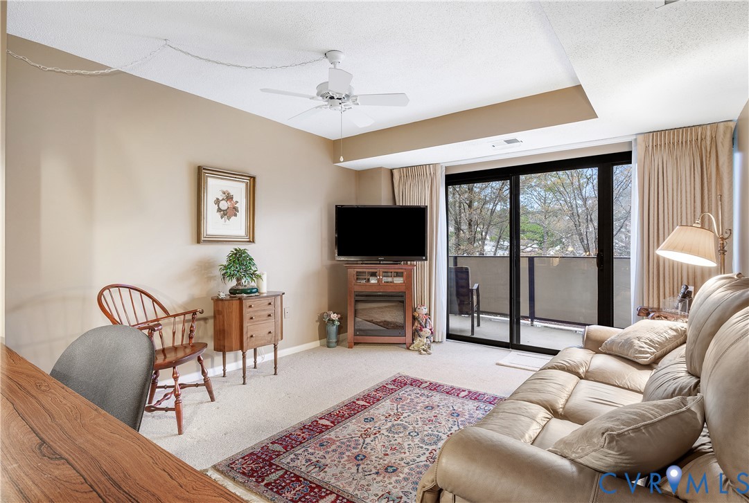 2956 Hathaway Road, Unit U301 Richmond, VA 23225 - Photo 25 of 36 a living room with furniture and a flat screen tv