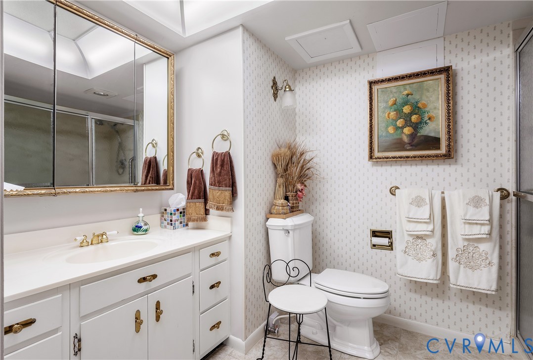 2956 Hathaway Road, Unit U301 Richmond, VA 23225 - Photo 27 of 36 a bathroom with a toilet a sink and mirror