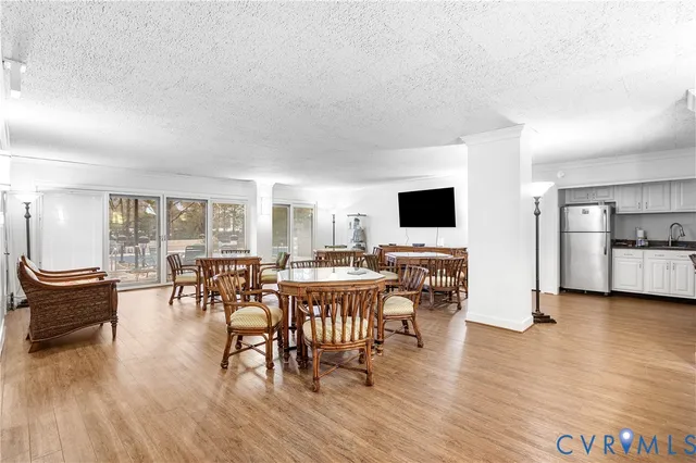 a view of a dining room with furniture and wooden floor