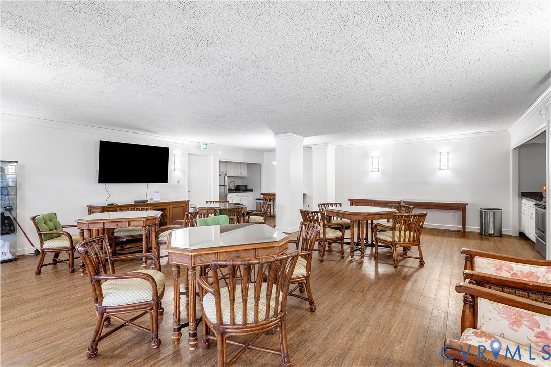 2956 Hathaway Road, Unit U301 Richmond, VA 23225 - Photo 30 of 36 a view of a dining room with furniture wooden floor and flat screen tv