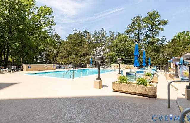a view of a swimming pool with a patio