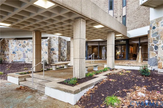 a front view of a building with outdoor seating