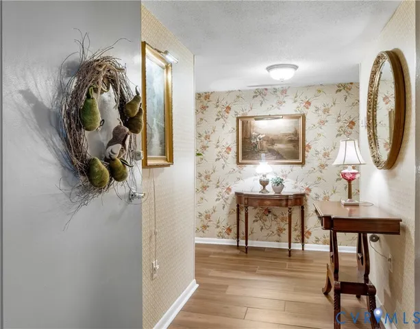 a living room with furniture and a mirror