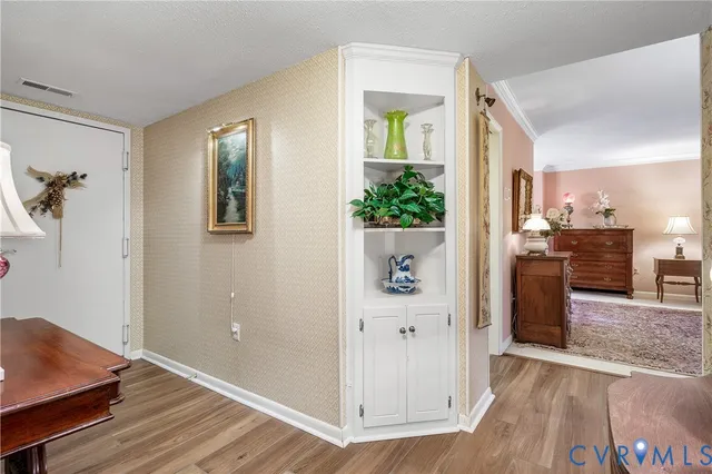 a view of kitchen with furniture and wooden floor
