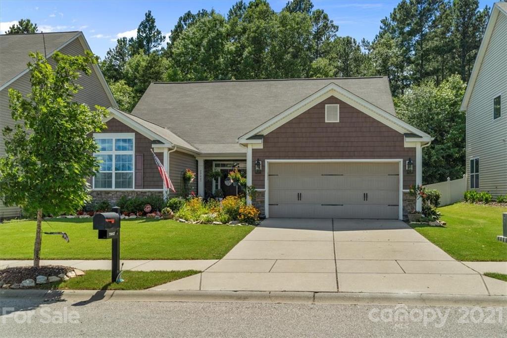 79067 Ridgehaven Road Lancaster, SC 29720 - Photo 1 of 38 a front view of a house with a yard and garage