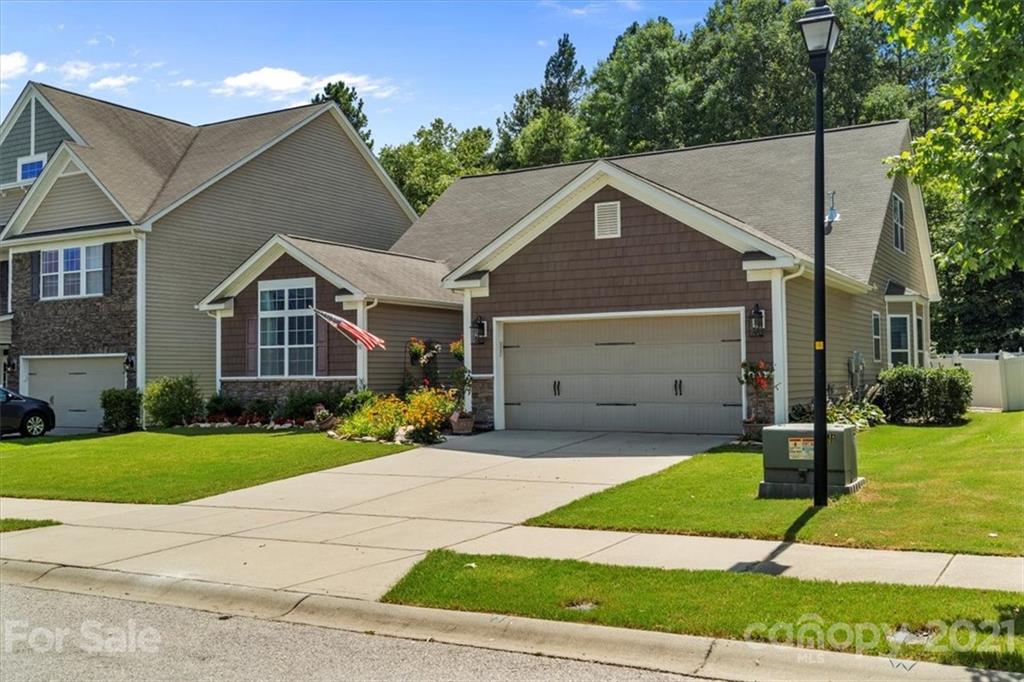 79067 Ridgehaven Road Lancaster, SC 29720 - Photo 2 of 38 a front view of a house with a yard and garage