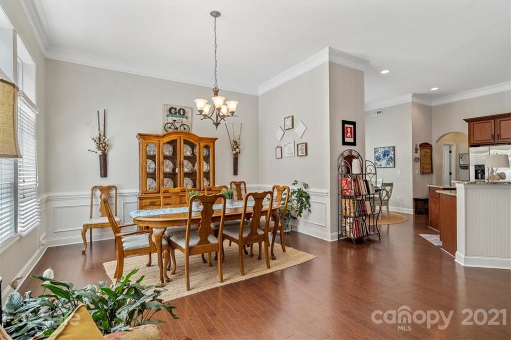 79067 Ridgehaven Road Lancaster, SC 29720 - Photo 11 of 38 a view of a dining room with furniture and wooden floor