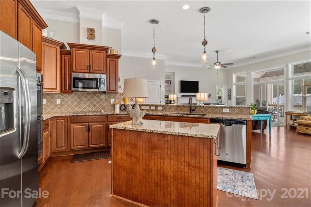 79067 Ridgehaven Road Lancaster, SC 29720 - Photo 12 of 38 a kitchen with stainless steel appliances granite countertop a sink a stove and a refrigerator