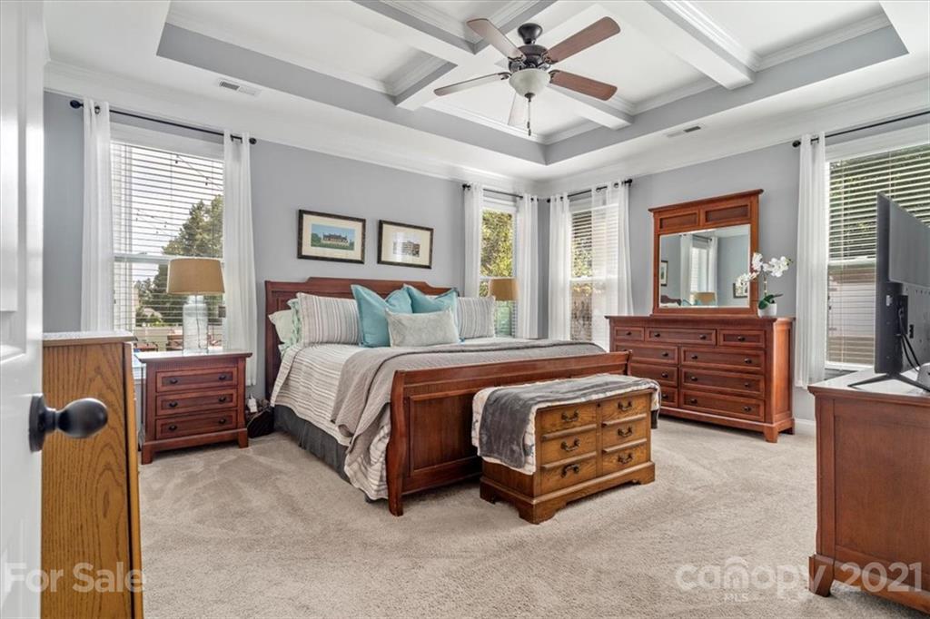 79067 Ridgehaven Road Lancaster, SC 29720 - Photo 17 of 38 a spacious bedroom with a bed a dresser and large window