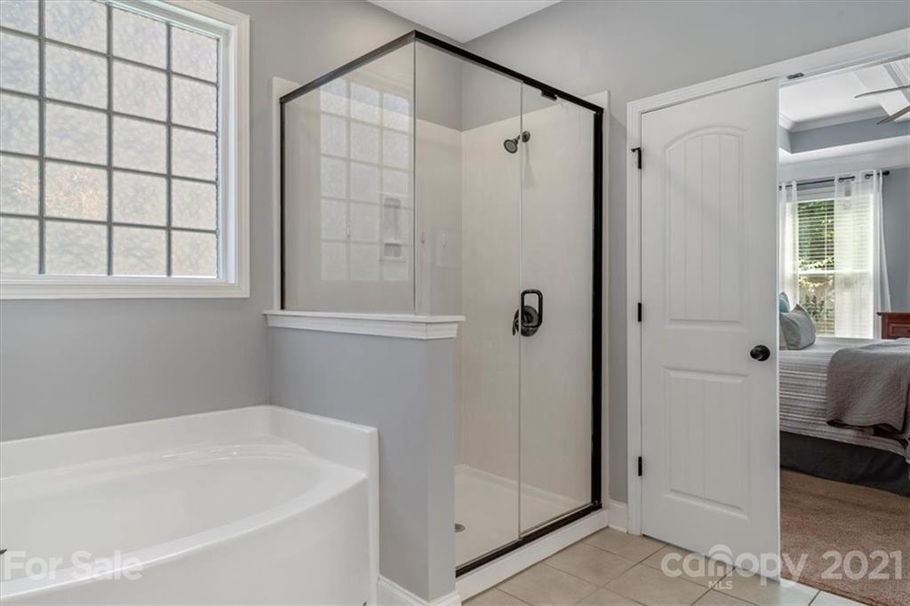 79067 Ridgehaven Road Lancaster, SC 29720 - Photo 19 of 38 a bathroom with a bathtub and a shower
