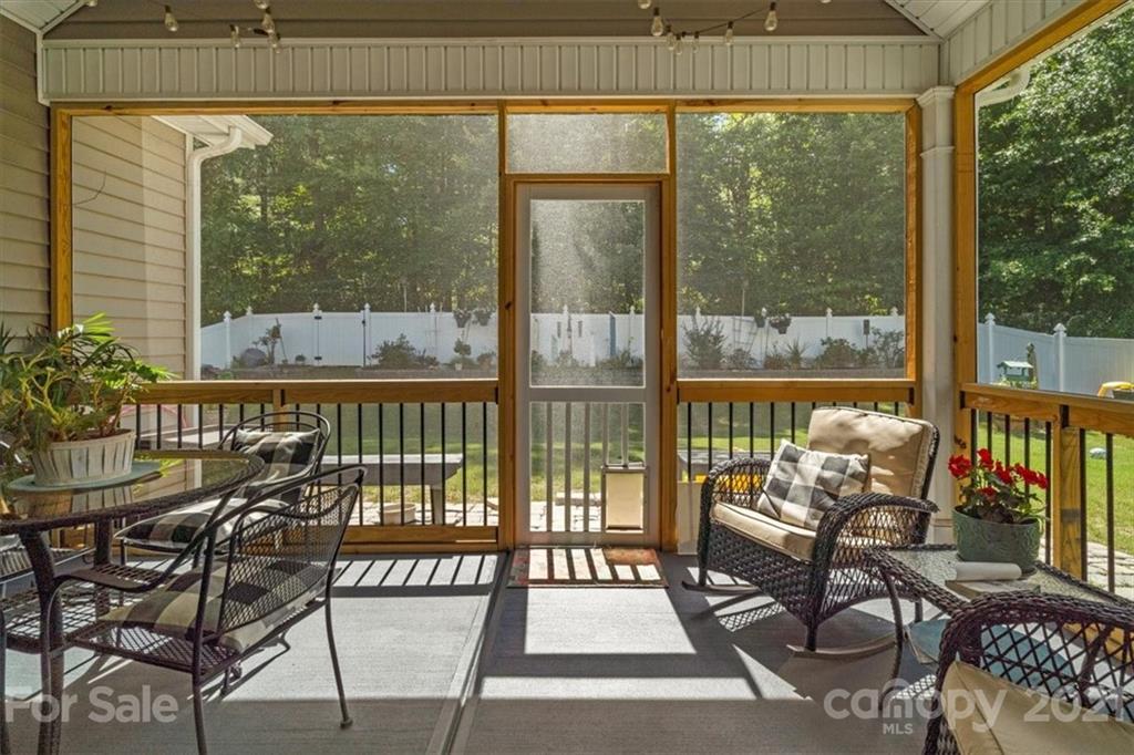 79067 Ridgehaven Road Lancaster, SC 29720 - Photo 26 of 38 a view of a balcony with chairs and wooden floor