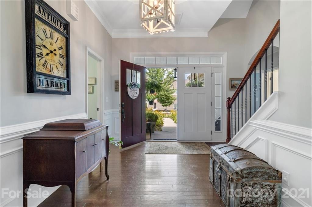 79067 Ridgehaven Road Lancaster, SC 29720 - Photo 4 of 38 a view of a hallway with entryway wooden floor windows and a kitchen area