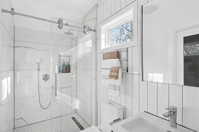 a bedroom with a large bed and a large window