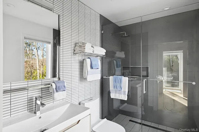 a bedroom with a bed and a mirror