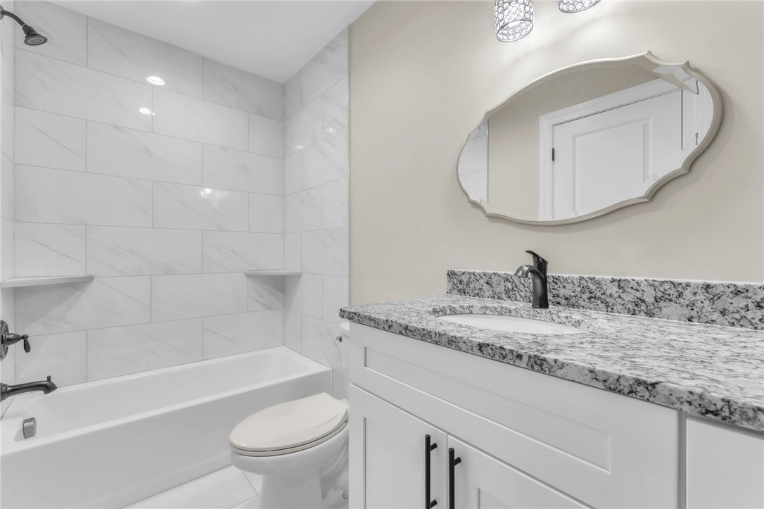 1015 Winmar Drive Anderson, SC 29621 - Photo 29 of 49 This bathroom features elegant granite counters and ceramic tile, creating a sleek and modern design.