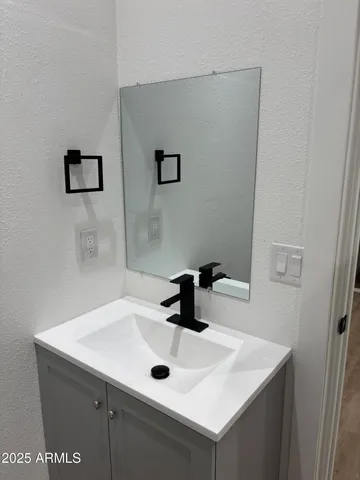a bathroom with a sink and a vanity