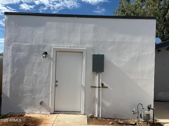 a bathroom with a shower and a sink