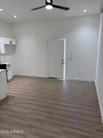 an empty room with wooden floor