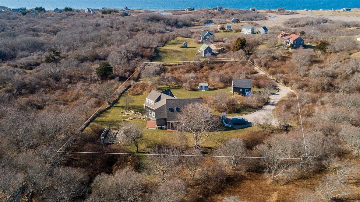 Coastal Charm situated on nearly 2 private acres with Guest Cottage! Lot lines are approximate.