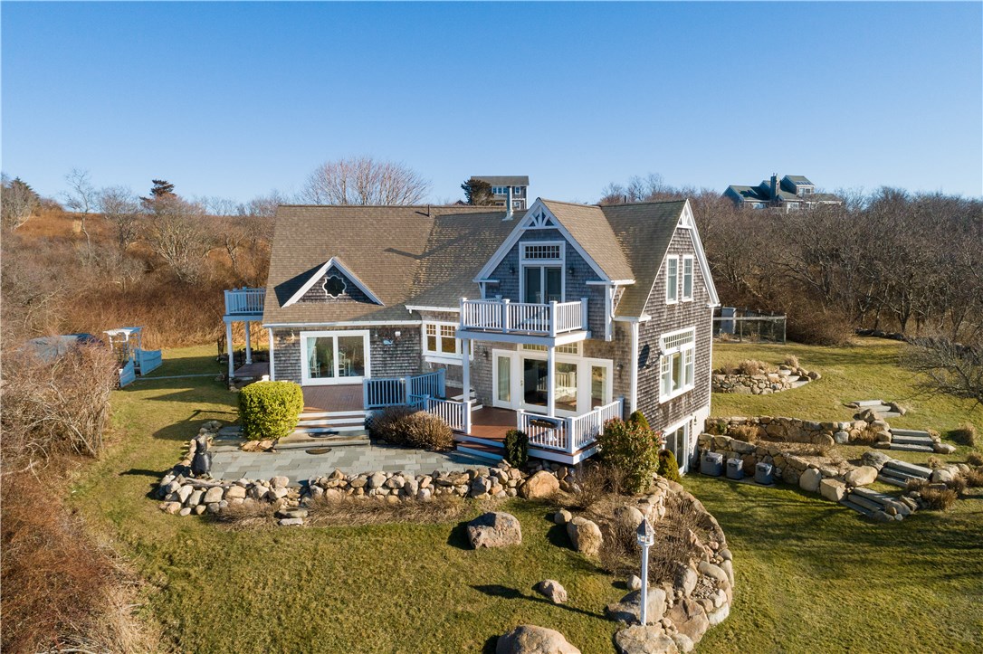 1507 West Side Road Block Island, RI 02807 - Photo 2 of 40 Set on nearly 2 acres this rolling country side features beautiful stone walls, blue stone patio, and multiple deck spaces!