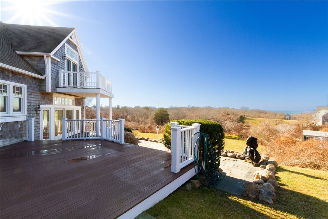 1507 West Side Road Block Island, RI 02807 - Photo 28 of 40 Second deck area off of dining room, steps down to a blue stone patio.
