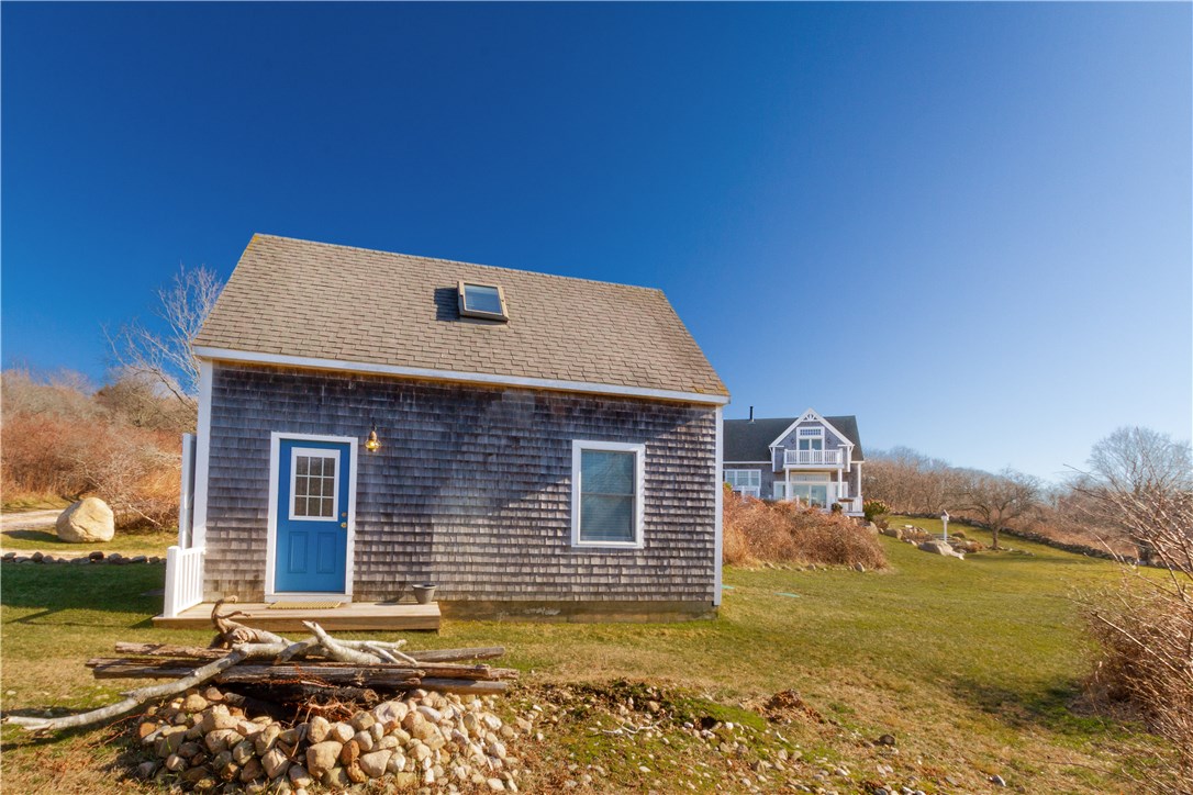 1507 West Side Road Block Island, RI 02807 - Photo 31 of 40 Side entrance to guest cottage with house main house in distance...plenty of privacy!