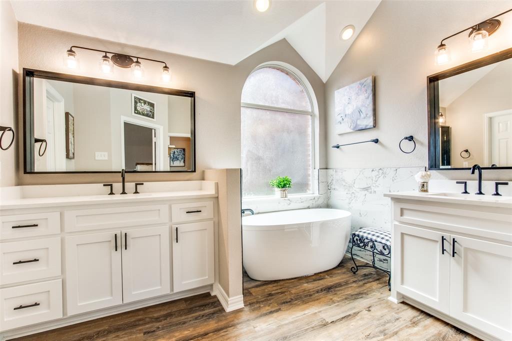 8060 Watson Road Lantana, TX 76226 - Photo 13 of 16 a bath room with a double vanity sink and a mirror