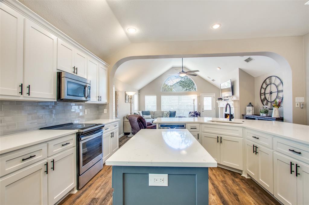 8060 Watson Road Lantana, TX 76226 - Photo 16 of 16 a large kitchen with stainless steel appliances lots of counter space and a sink