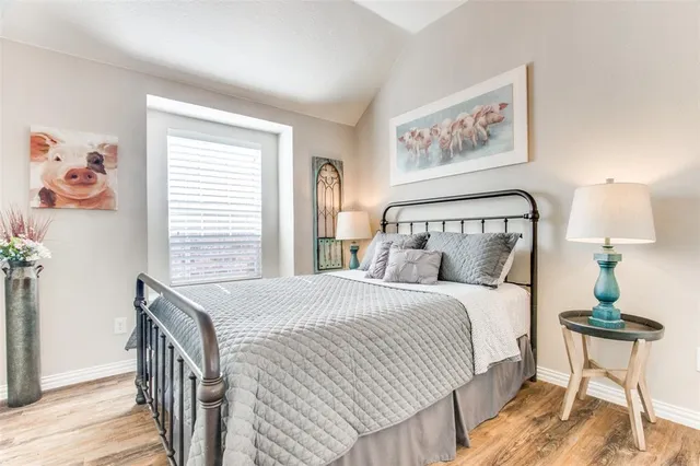 a kitchen with stainless steel appliances a dining table chairs microwave and cabinets