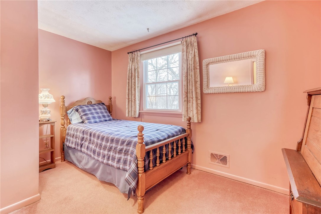 6930 Lakeside Road Ontario, NY 14519 - Photo 25 of 40 2nd floor bedroom #4 Hardwood floors under carpeti