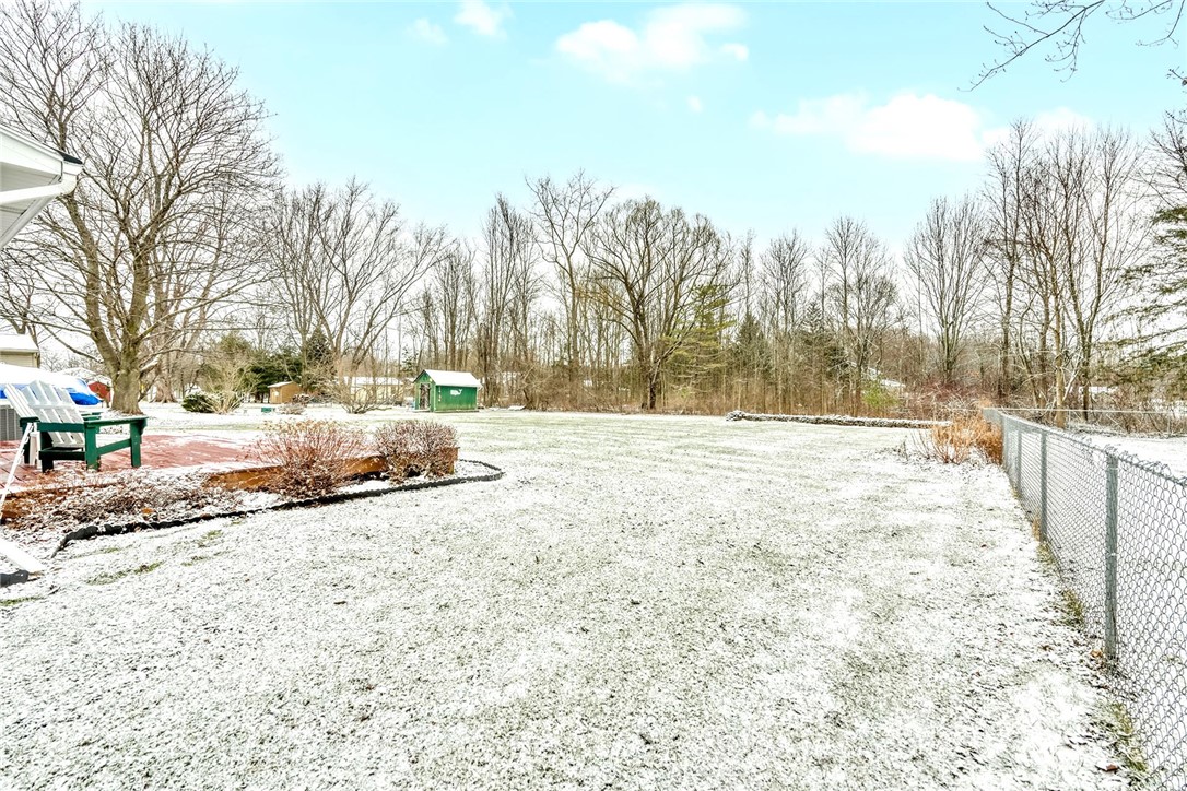 6930 Lakeside Road Ontario, NY 14519 - Photo 35 of 40 Backyard with deck and stone accent wall