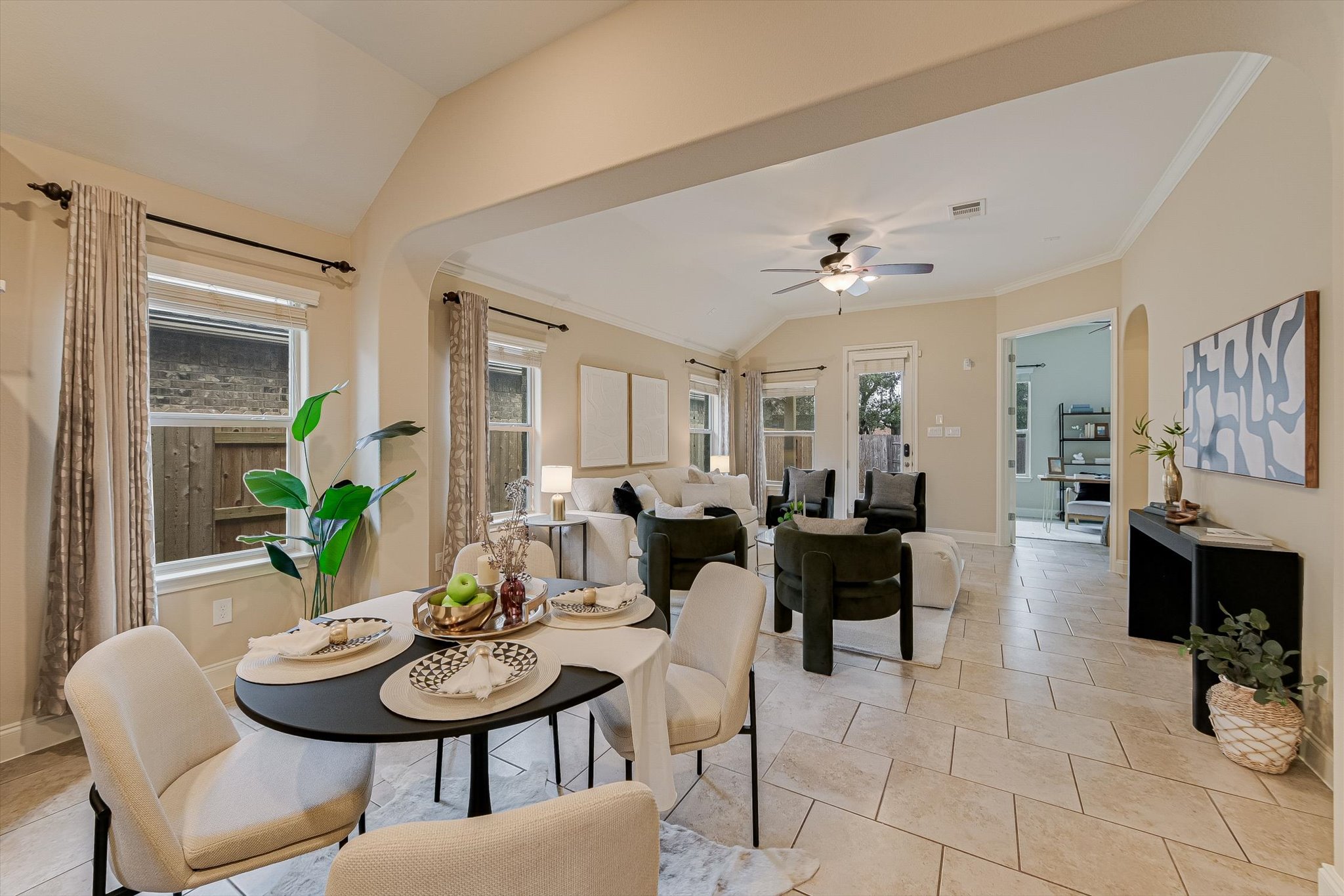 13017 Hymeadow Circle Austin, TX 78729 - Photo 12 of 32 a living room with furniture and a dining table with chairs