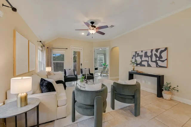 a view of a livingroom with furniture and a potted plant