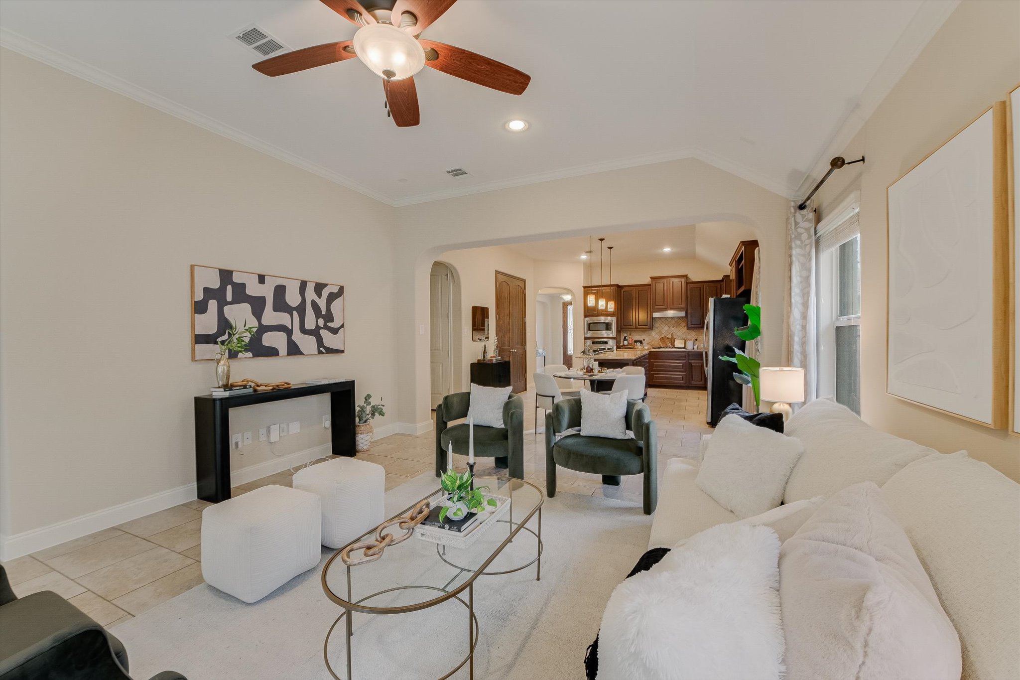 13017 Hymeadow Circle Austin, TX 78729 - Photo 16 of 32 a living room with furniture and a chandelier